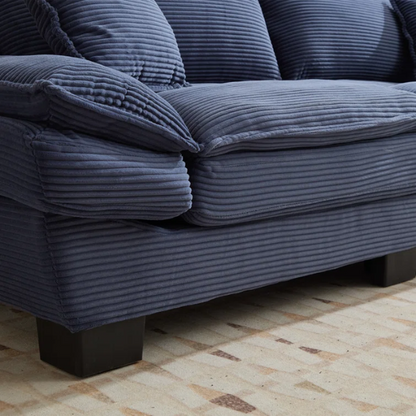 84-inch blue corduroy loveseat with striped upholstery, pillow-top arms, and two accent pillows—modern, low-profile design ideal for stylish living rooms or small spaces.

