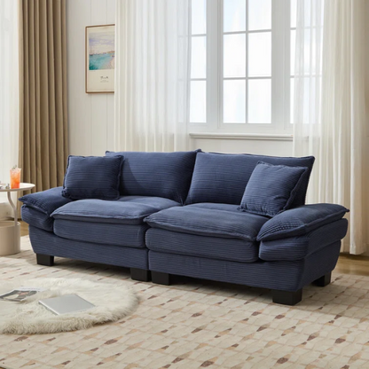 84-inch blue corduroy loveseat with striped upholstery, pillow-top arms, and two accent pillows—modern, low-profile design ideal for stylish living rooms or small spaces.

