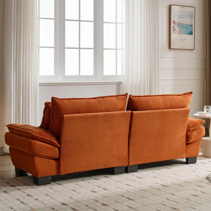 84-inch burnt orange corduroy loveseat with striped upholstery, pillow-top arms, and two accent pillows—modern, low-profile design ideal for vibrant, stylish interiors.

