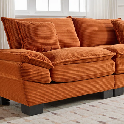 84-inch burnt orange corduroy loveseat with striped upholstery, pillow-top arms, and two accent pillows—modern, low-profile design ideal for vibrant, stylish interiors.

