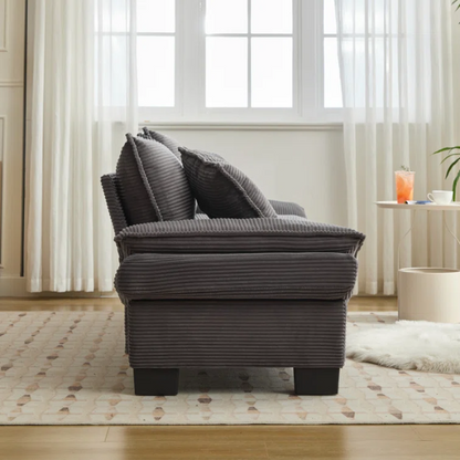 84-inch grey corduroy loveseat with striped upholstery, pillow-top arms, and two accent pillows—modern, low-profile design ideal for living rooms, apartments, or home offices.

