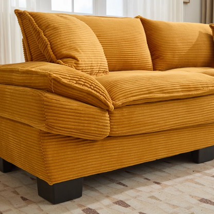 84-inch mustard yellow corduroy loveseat with striped upholstery, pillow-top arms, and two accent pillows—modern, low-profile design ideal for stylish living rooms, apartments, or creative spaces.

