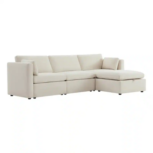 Beige modular four-piece sectional sofa with wide seats, soft chenille fabric, removable cushions, and built-in storage ottoman — ideal for modern and adaptable living room layouts.

