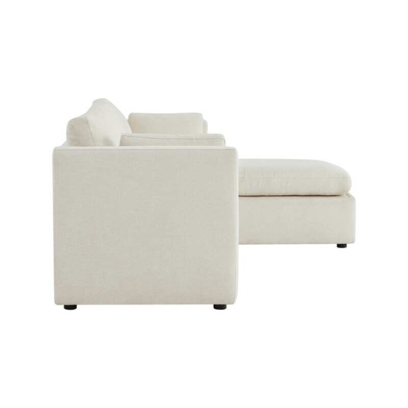 Beige modular four-piece sectional sofa with wide seats, soft chenille fabric, removable cushions, and built-in storage ottoman — ideal for modern and adaptable living room layouts.

