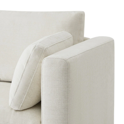 Beige five-piece modular sectional sofa with wide chenille-upholstered seats, two gas-lift storage ottomans, and reversible cushions — a modern and comfortable centerpiece for any living room.

