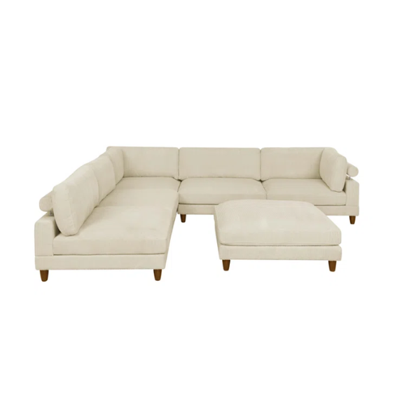 Beige modular sectional sofa with corduroy upholstery, removable cushions, and matching ottoman – seats six in a modern L-shaped or U-shaped layout with solid wood legs.

