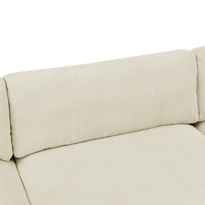 Beige modular sectional sofa with corduroy upholstery, removable cushions, and matching ottoman – seats six in a modern L-shaped or U-shaped layout with solid wood legs.

