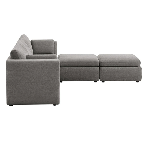 Dark grey five-piece modular sectional sofa with wide chenille-upholstered seats, two gas-lift storage ottomans, and reversible cushions — perfect for flexible and modern living spaces.

