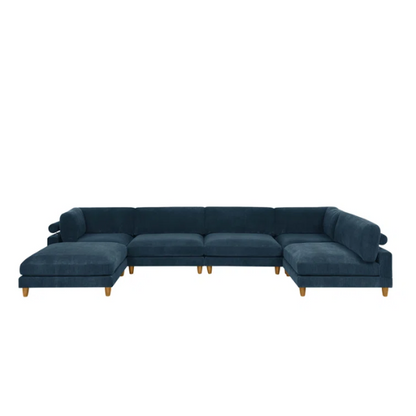 Deep teal modular sectional sofa with plush corduroy fabric, removable cushions, and a matching ottoman — seats six in flexible L- or U-shaped configurations.

