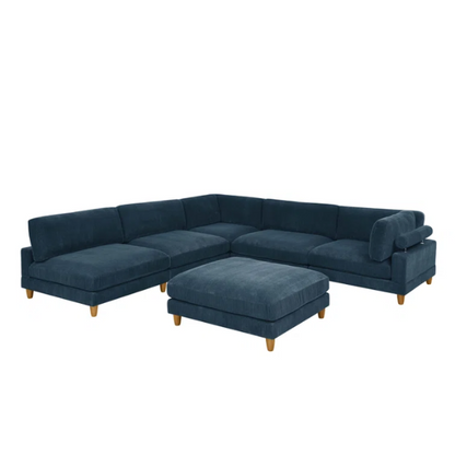 Deep teal modular sectional sofa with plush corduroy fabric, removable cushions, and a matching ottoman — seats six in flexible L- or U-shaped configurations.

