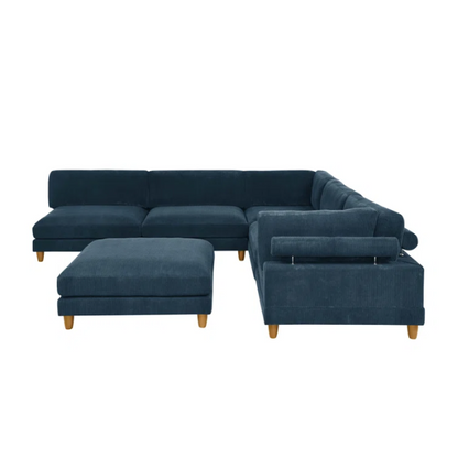 Deep teal modular sectional sofa with plush corduroy fabric, removable cushions, and a matching ottoman — seats six in flexible L- or U-shaped configurations.

