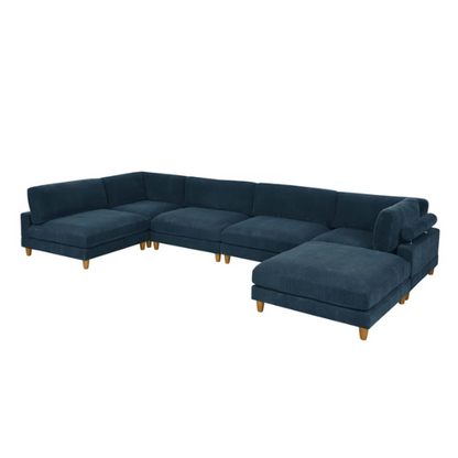 Deep teal modular sectional sofa with plush corduroy fabric, removable cushions, and a matching ottoman — seats six in flexible L- or U-shaped configurations.

