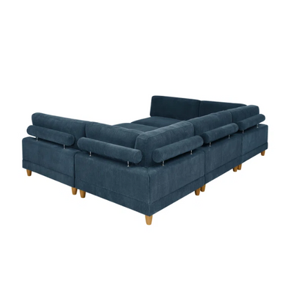 Deep teal modular sectional sofa with plush corduroy fabric, removable cushions, and a matching ottoman — seats six in flexible L- or U-shaped configurations.

