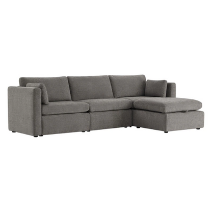 Grey four-piece modular sofa set with wide seats, soft chenille upholstery, removable cushions, and a storage ottoman — ideal for modern, versatile living spaces.

