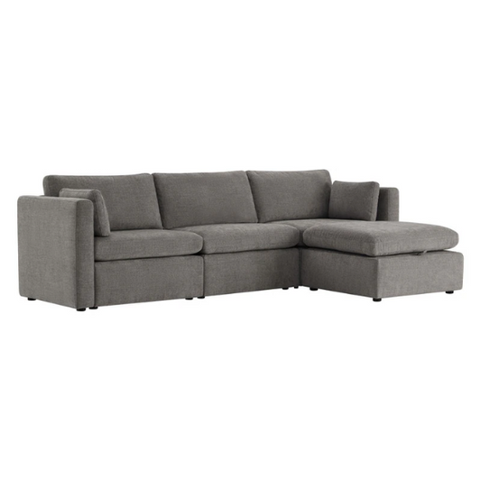 Grey four-piece modular sofa set with wide seats, soft chenille upholstery, removable cushions, and a storage ottoman — ideal for modern, versatile living spaces.

