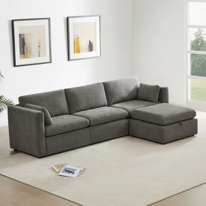 Grey four-piece modular sofa set with wide seats, soft chenille upholstery, removable cushions, and a storage ottoman — ideal for modern, versatile living spaces.


