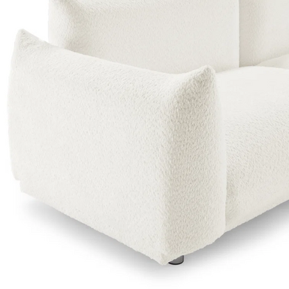 88.9-inch cream white upholstered sofa with chrome legs, deep seating, rounded arms, and four matching accent pillows, ideal for modern or minimalist interiors.

