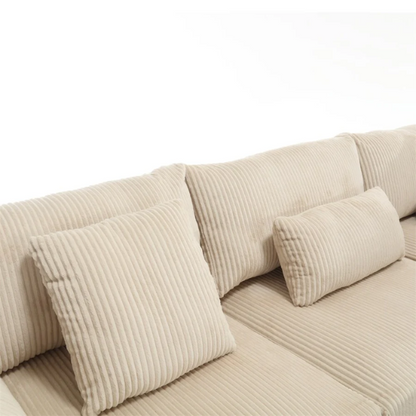 Modular beige corduroy sectional sofa with reversible L-shaped configuration, removable cushions, and soft high-density foam seating — ideal for modern or classic interiors.

