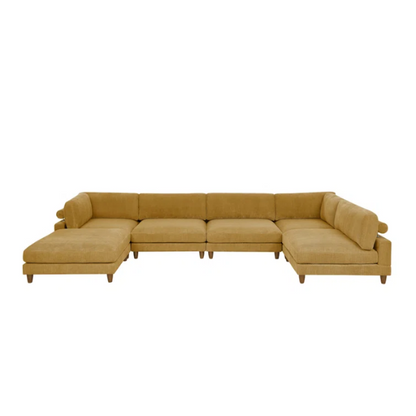 Modular mustard yellow corduroy sectional sofa with removable cushions, deep seating, and a matching ottoman — ideal for bold, spacious living room layouts.

