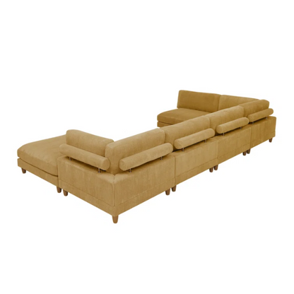 Modular mustard yellow corduroy sectional sofa with removable cushions, deep seating, and a matching ottoman — ideal for bold, spacious living room layouts.

