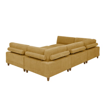 Modular mustard yellow corduroy sectional sofa with removable cushions, deep seating, and a matching ottoman — ideal for bold, spacious living room layouts.

