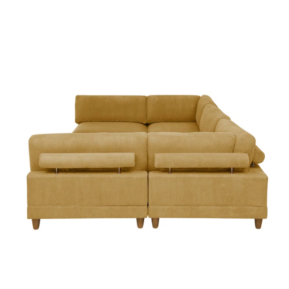 Modular mustard yellow corduroy sectional sofa with removable cushions, deep seating, and a matching ottoman — ideal for bold, spacious living room layouts.

