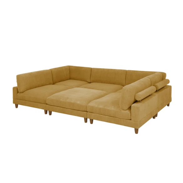 Modular mustard yellow corduroy sectional sofa with removable cushions, deep seating, and a matching ottoman — ideal for bold, spacious living room layouts.

