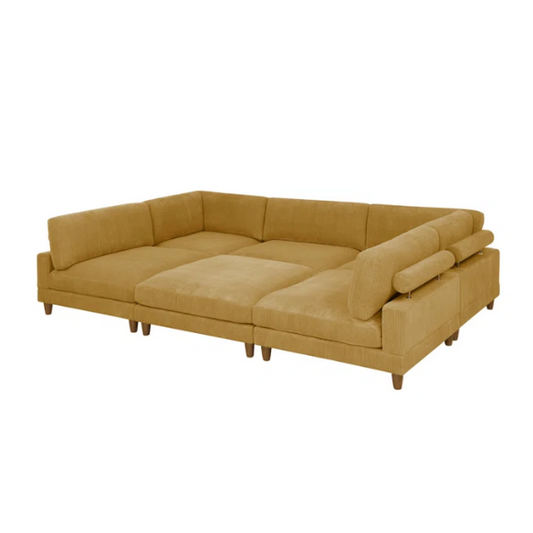 Modular mustard yellow corduroy sectional sofa with removable cushions, deep seating, and a matching ottoman — ideal for bold, spacious living room layouts.

