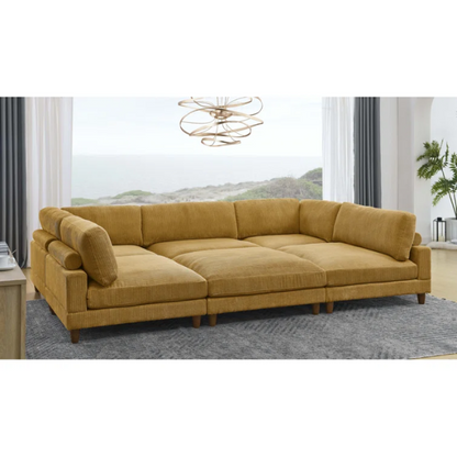 Modular mustard yellow corduroy sectional sofa with removable cushions, deep seating, and a matching ottoman — ideal for bold, spacious living room layouts.

