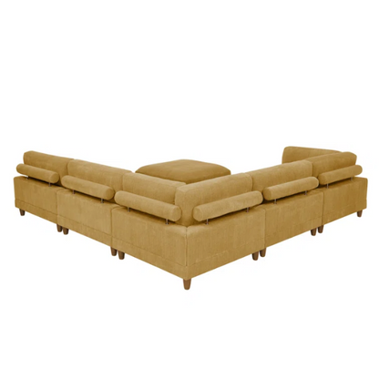 Modular mustard yellow corduroy sectional sofa with removable cushions, deep seating, and a matching ottoman — ideal for bold, spacious living room layouts.

