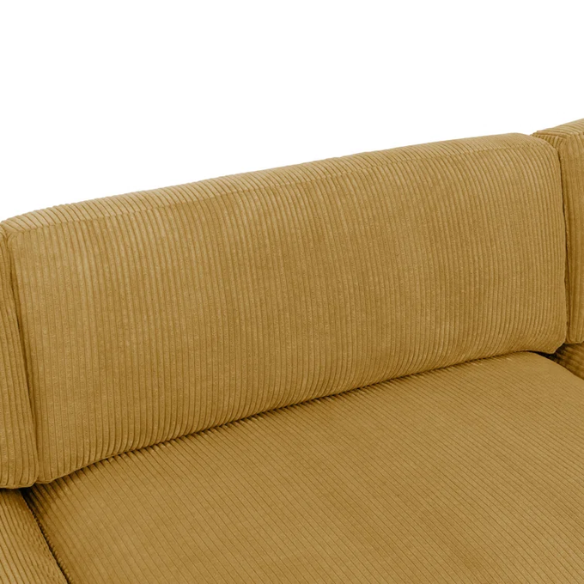 Modular mustard yellow corduroy sectional sofa with removable cushions, deep seating, and a matching ottoman — ideal for bold, spacious living room layouts.

