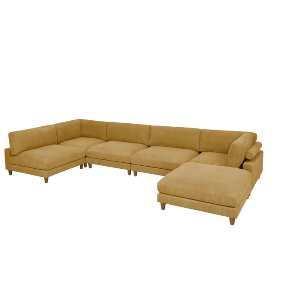 Modular mustard yellow corduroy sectional sofa with removable cushions, deep seating, and a matching ottoman — ideal for bold, spacious living room layouts.

