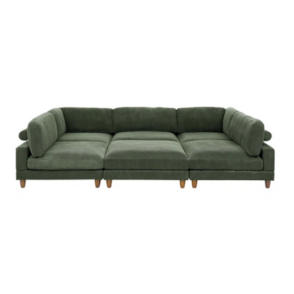 Olive drab green modular sectional sofa with soft corduroy upholstery, removable cushions, and matching ottoman — seats six with L-shaped or U-shaped layout options.

