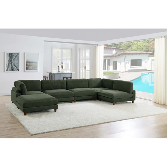 Olive drab green modular sectional sofa with soft corduroy upholstery, removable cushions, and matching ottoman — seats six with L-shaped or U-shaped layout options.

