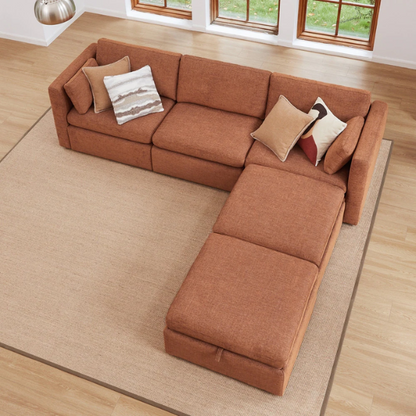 Terracotta five-piece modular sectional sofa with wide chenille seats, two gas-lift storage ottomans, and reversible cushions — designed for comfort and flexibility in modern homes.

