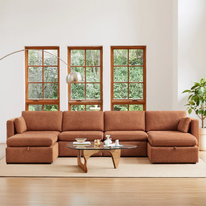 Terracotta six-piece modular sofa set featuring wide chenille-upholstered seats, two gas-lift storage ottomans, and reversible cushions — a bold, earthy centerpiece for modern or eclectic interiors.

