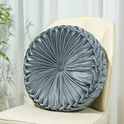 Gray velvet round throw pillow with ribbed edges and button closure, luxurious soft cotton fill, elegant decorative cushion for sofa or home décor.