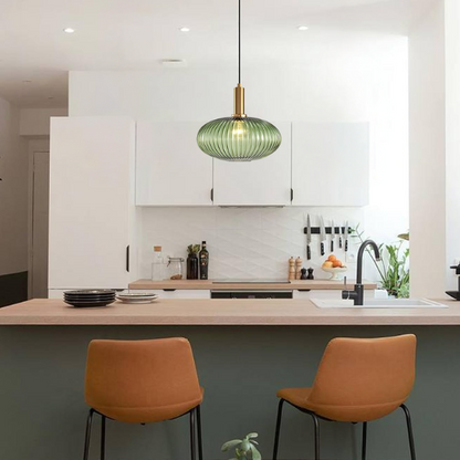 Green glass pendant light with gold accents and matte black metal frame – modern industrial chandelier for dining, living room, or kitchen.