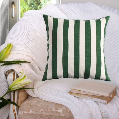 Striped accent pillow in green and white – reversible, weather-resistant, and overstuffed with polyester fill for both indoor and outdoor use.


