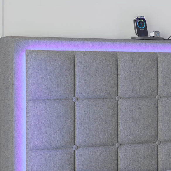 Grey full size button-tufted upholstered platform bed with LED lighted headboard and built-in charging ports.