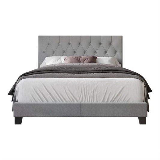 Grey linen full size upholstered bed with button tufted headboard and low-profile legs