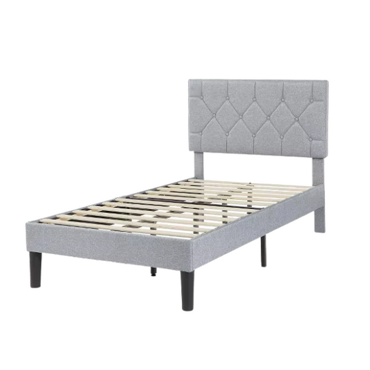 Modern grey upholstered twin bed with button-tufted headboard, steel frame, and slatted base – no box spring required