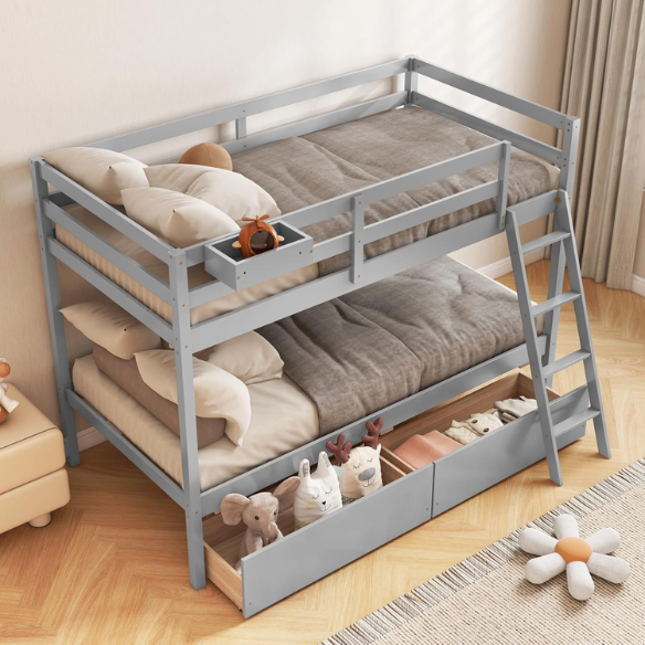 Grey twin-over-twin bunk bed with storage drawers, safety guardrails, and ladder, made of sturdy pine wood with modern design for kids’ bedrooms