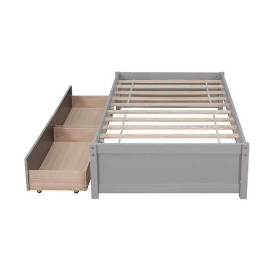 Grey twin platform bed with two underbed storage drawers, made from solid wood with a modern low-profile design—perfect for kids, teens, or guest rooms.


