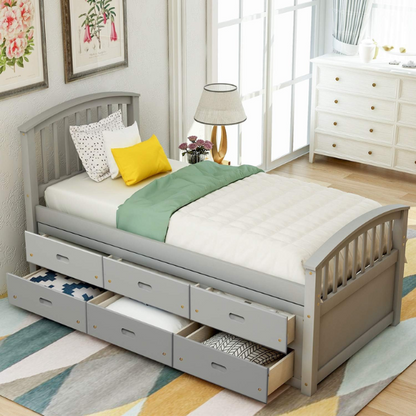 Grey twin bed frame made from solid pine wood with underbed storage drawers, finished in non-toxic paint with a slatted base, ideal for children or teens in a modern bedroom.

