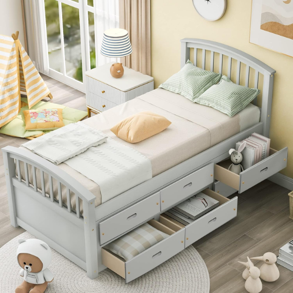 Grey twin bed frame made from solid pine wood with underbed storage drawers, finished in non-toxic paint with a slatted base, ideal for children or teens in a modern bedroom.

