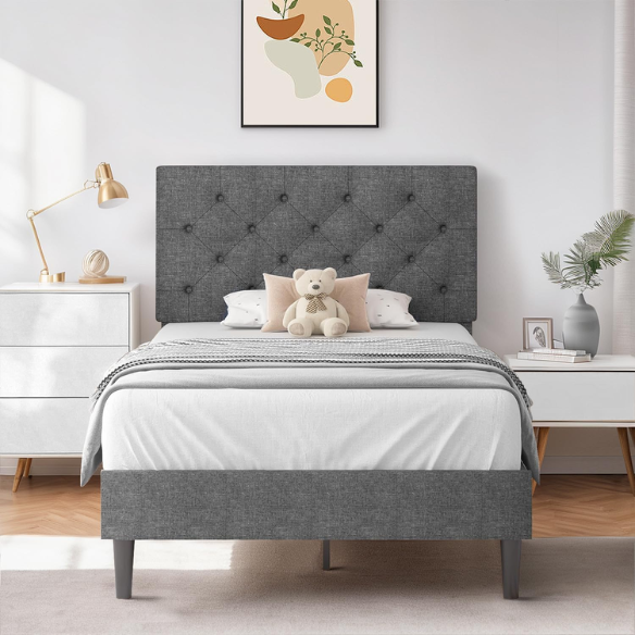 Grey twin upholstered bed frame with button-tufted adjustable headboard, wooden slats, and soft linen fabric for kids or guest rooms.

