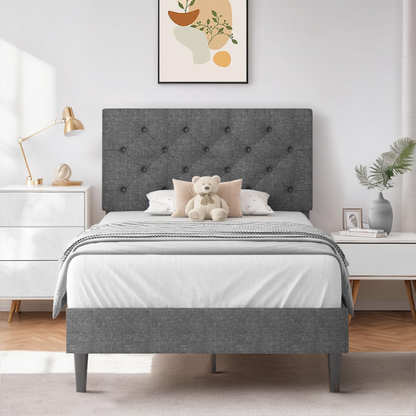 Grey twin upholstered bed frame with button-tufted adjustable headboard, wooden slats, and soft linen fabric for kids or guest rooms.

