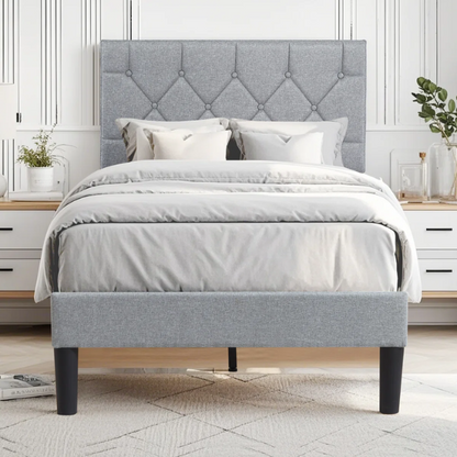 Grey upholstered twin platform bed frame with diamond-tufted linen headboard, sturdy metal construction, and center support legs, no box spring needed.

