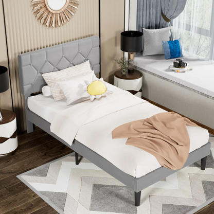 Grey upholstered twin platform bed frame with diamond-tufted linen headboard, sturdy metal construction, and center support legs, no box spring needed.

